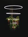 A stylish LED chandelier with cascading greenery and a sleek design, perfect for modern interiors.